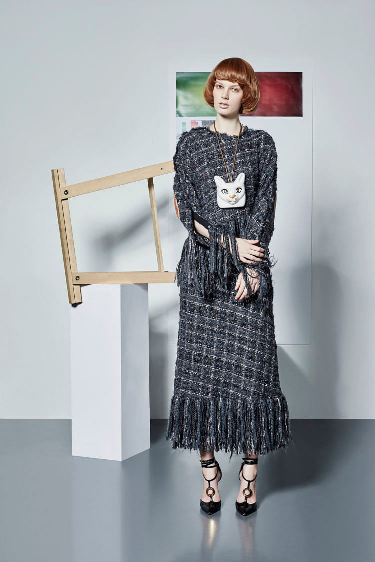 Wool-blend top, matching midi skirt, leather necklace with porcelain pendant, and patent leather ankle-strap d’Orsays, Loewe 